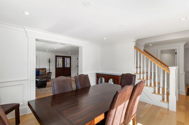 Dining room with light hardwood / wood-style flooring and ornamental molding | Image 21