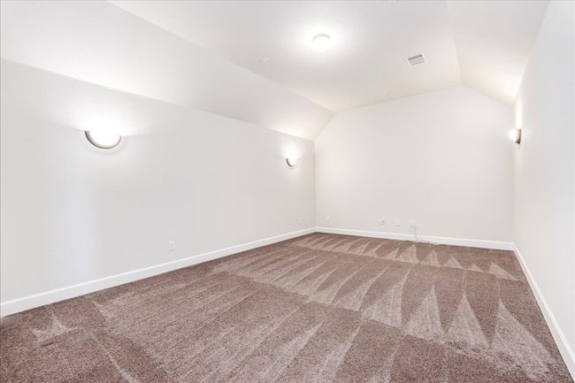 Bonus room with lofted ceiling and carpet flooring | Image 24