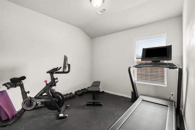 Secondary bedroom set up as a workout space | Image 9