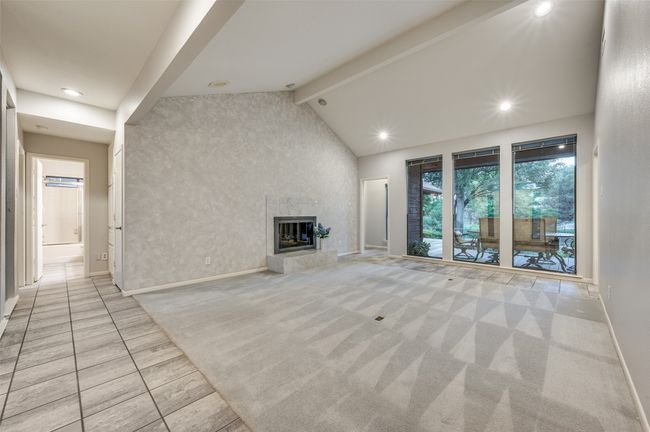 Living room also has a wall of windows which frames the beautiful backyard paradise | Image 8