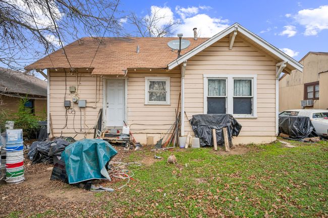 Rear view of house featuring a lawn and cooling unit | Image 8