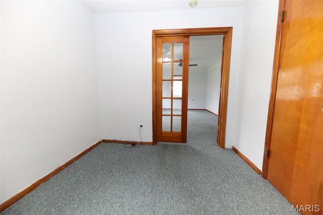 Unfurnished room with baseboards, crown molding, and carpet flooring | Image 15