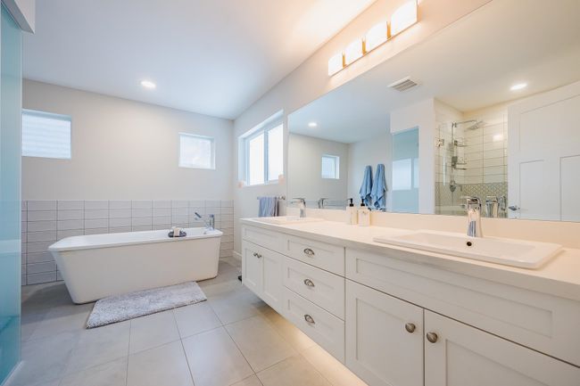 Ensuite bathroom with connected bathroom, ceiling fan, and a stall shower | Image 20