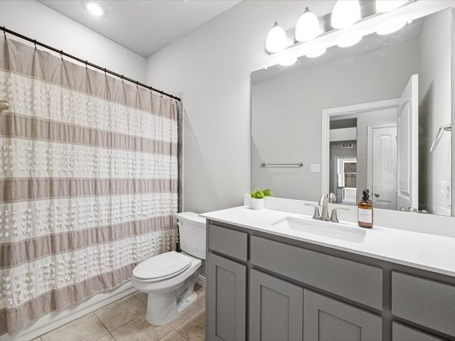 Full bath with vanity, toilet, and tile patterned floors | Image 20
