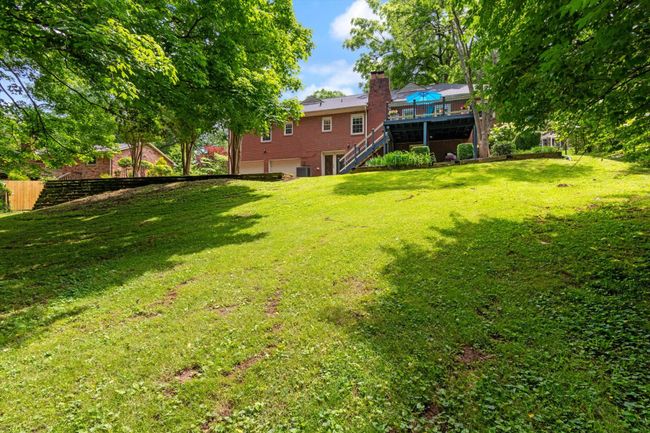 Lush backyard with mature trees! Let's get you home in West Meade Highlands! | Image 35