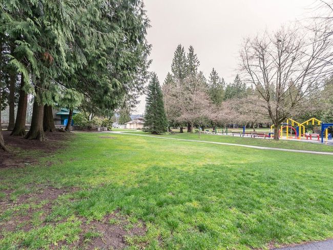 View of home's community with a yard and playground community | Image 21