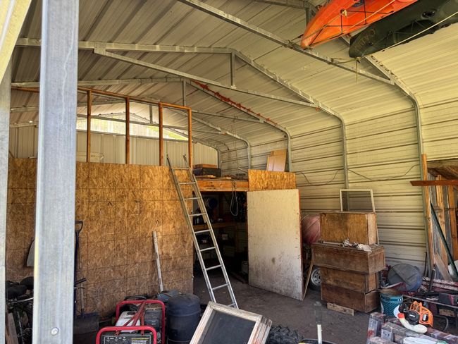 Garage featuring metal wall | Image 31