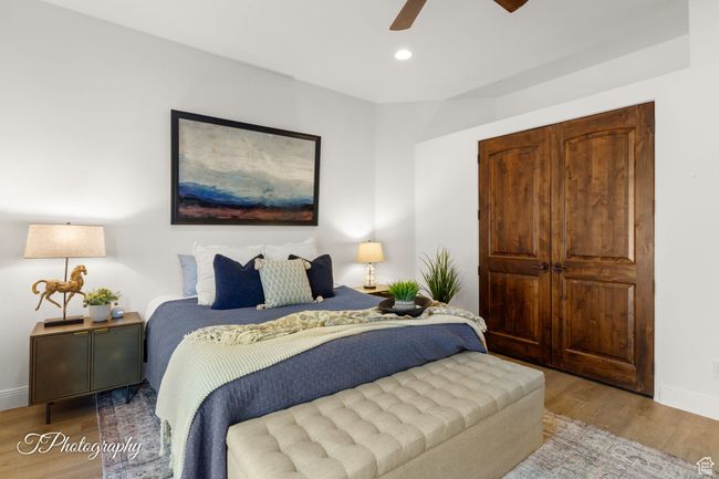 Bedroom featuring wood finished floors, baseboards, recessed lighting, and a ceiling fan | Image 32