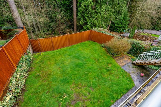 View of yard featuring a fenced backyard | Image 7