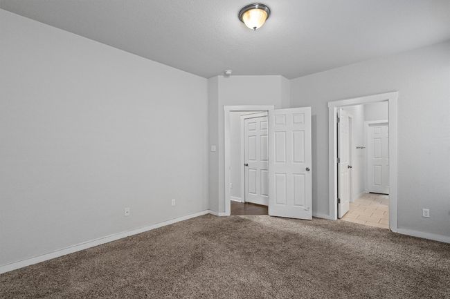Unfurnished bedroom with carpet and baseboards | Image 22