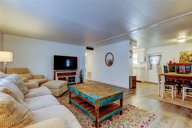 29. Living & Dining Area is a HUGE GREAT ROOM tht Flows Into Kitchen & BONUS Room! LOVE Cohesive & Tasteful Furnishings = ALL INCLUDED!!. | Image 28