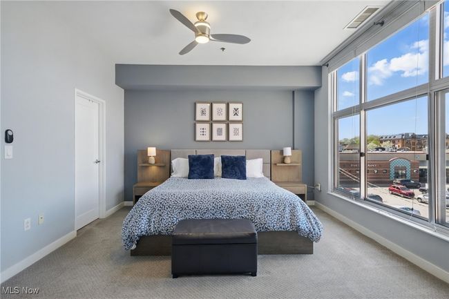 Bedroom featuring carpet floors, visible vents, a ceiling fan, and baseboards | Image 22