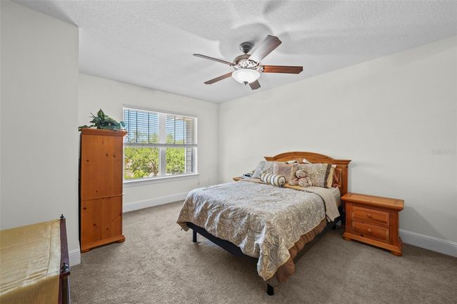 Primary bedroom features high ceilings | Image 15