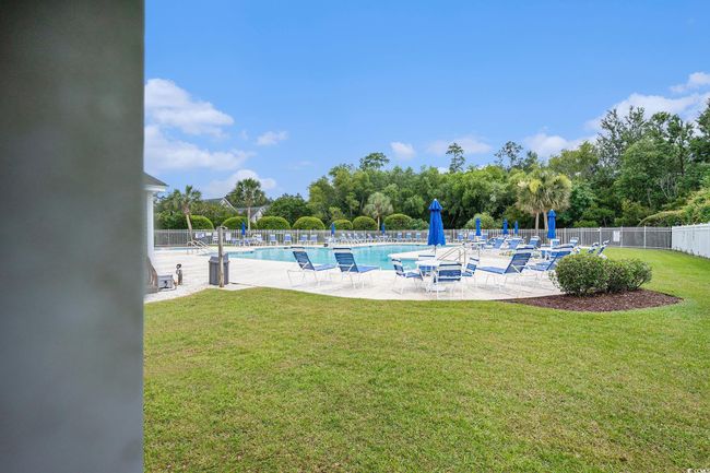 Community pool with a patio area | Image 30