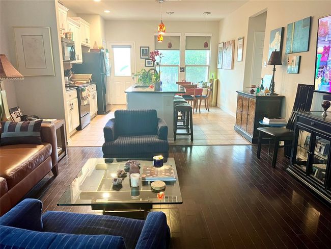 Living room with light wood-style floors, recessed lighting, and baseboards | Image 4