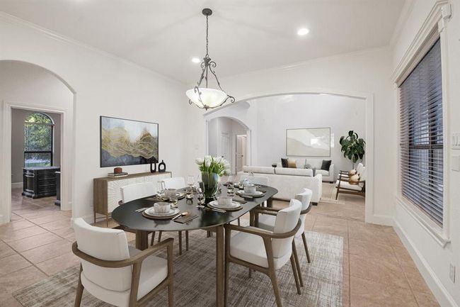 Dining area, with a tasteful chandelier, is open to the living room and kitchen and ready for entertaining and all your family meals. This picture is virtually staged. | Image 14