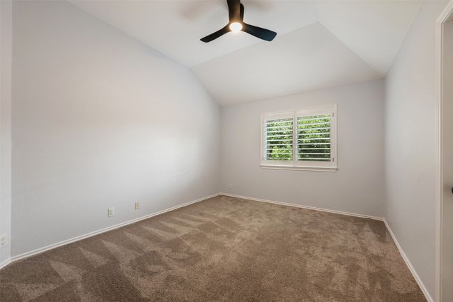 Bedroom with a walk-in closet. | Image 28