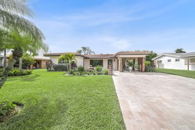 Grass garden in the front of the home adds charm. | Image 2