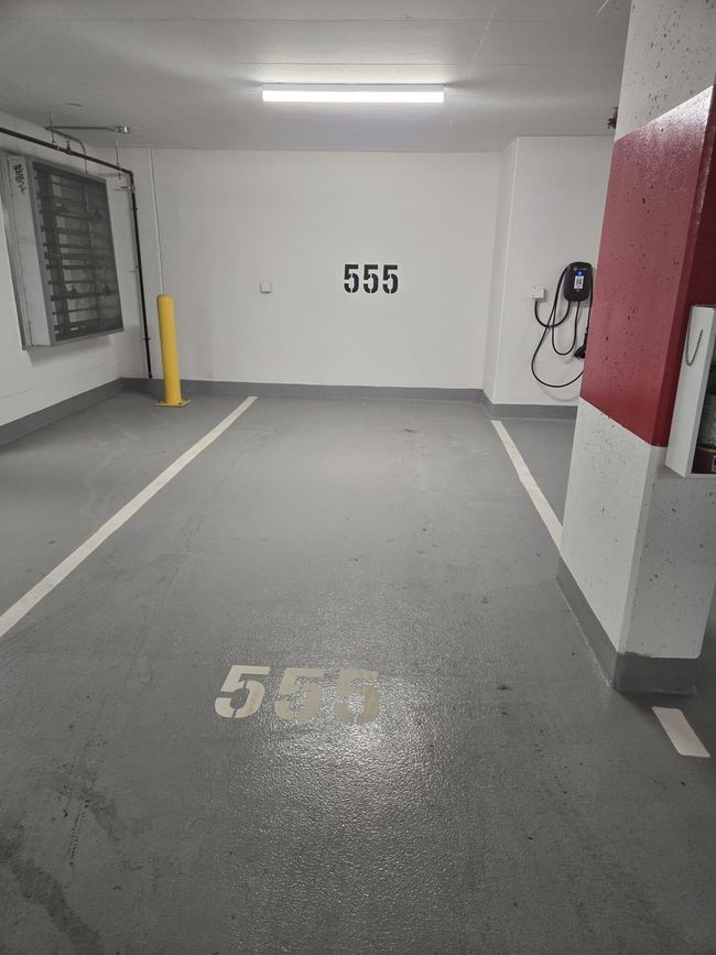 Parking garage featuring baseboards | Image 19