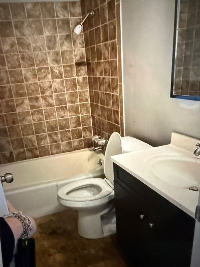 Full bath featuring vanity and tub / shower combination | Image 19