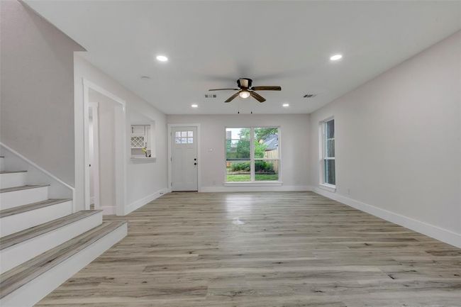New Vinyl flooring in the living room and throughout the whole house for easy maintenance. | Image 7