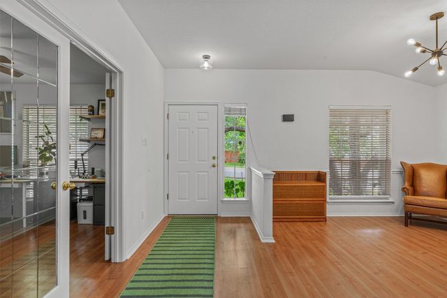 Foyer with light wood-type flooring, a chandelier, and vaulted ceiling | Image 4