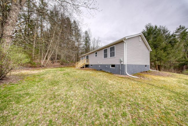 View of side of home featuring a yard | Image 29
