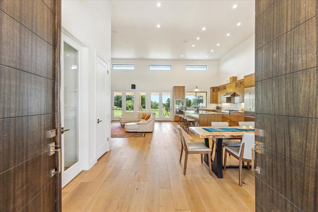 Stunning entry with double eight foot custom doors. | Image 15