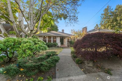 Bucolic landscaping and gracious entry to mid-century home close to Magnolia Village | Image 1