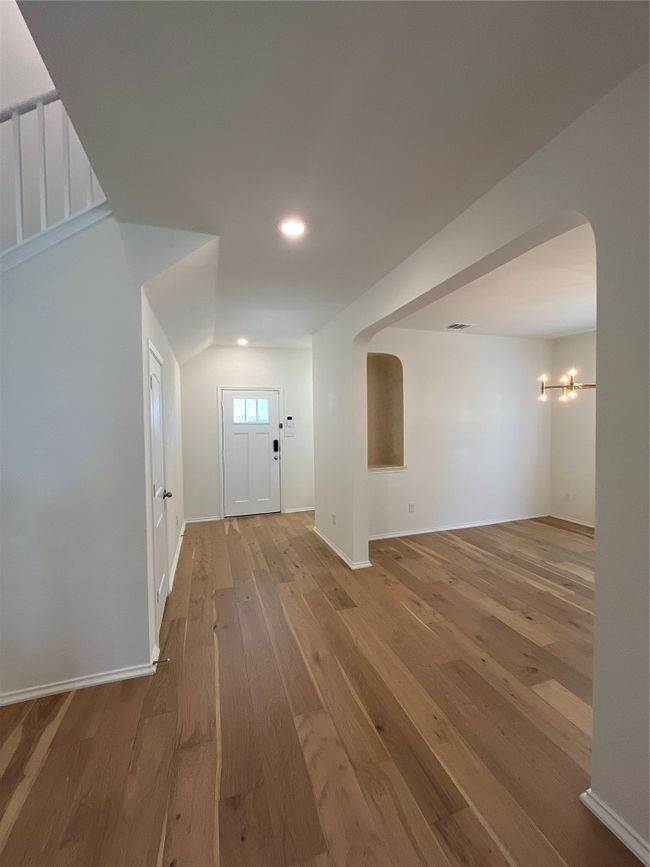 Entryway featuring recessed lighting, arched walkways, baseboards, and hardwood / wood-style floors | Image 7