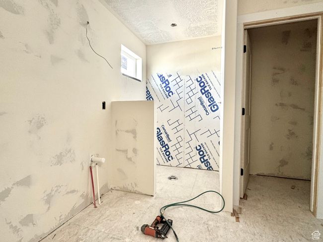 Bathroom with a textured ceiling | Image 19