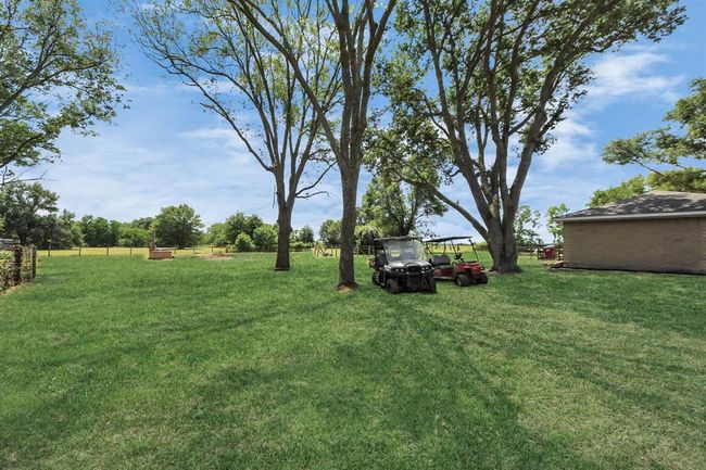 Wide open, the backyard offers space to play, garden, or simply unwind. | Image 32
