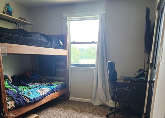 Bedroom featuring multiple windows and carpet floors | Image 26