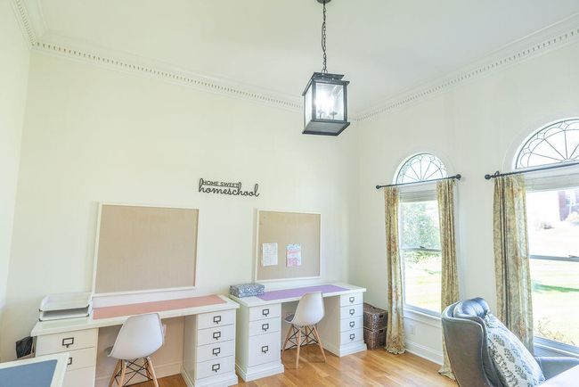 Living room currently used as classroom for 4 children taught at home. | Image 39