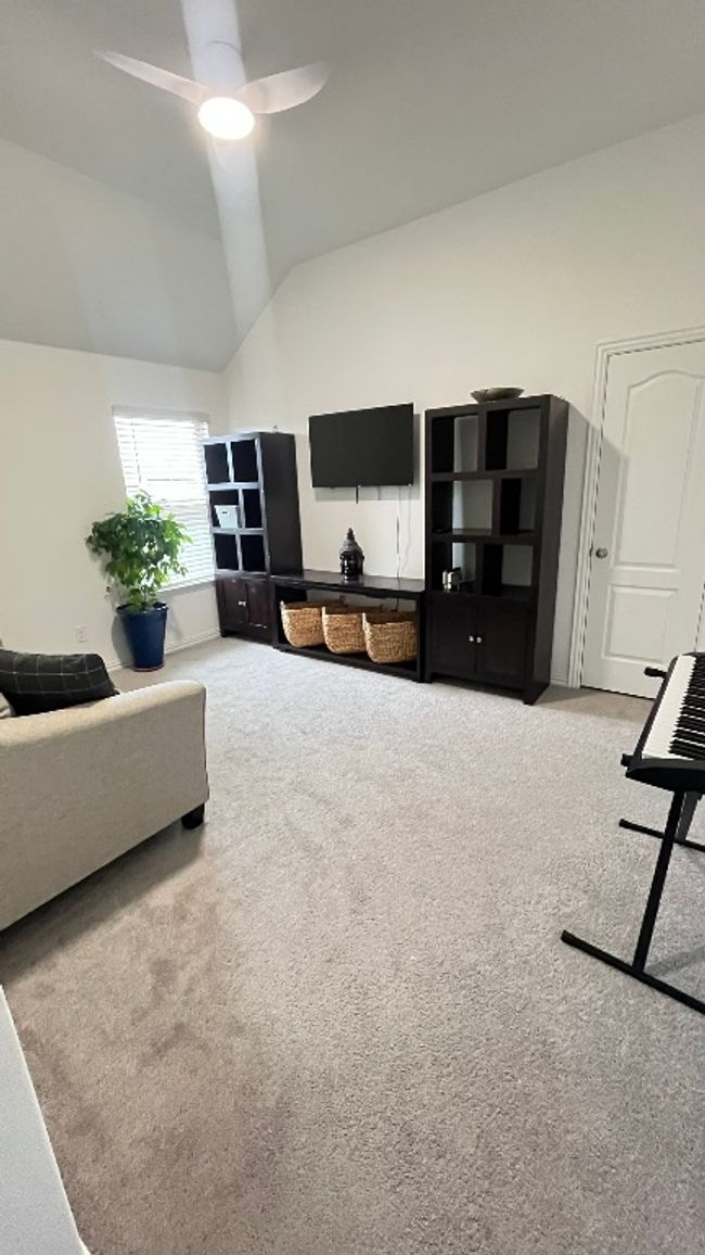 Living area featuring carpet flooring, high vaulted ceiling, and a ceiling fan | Image 27