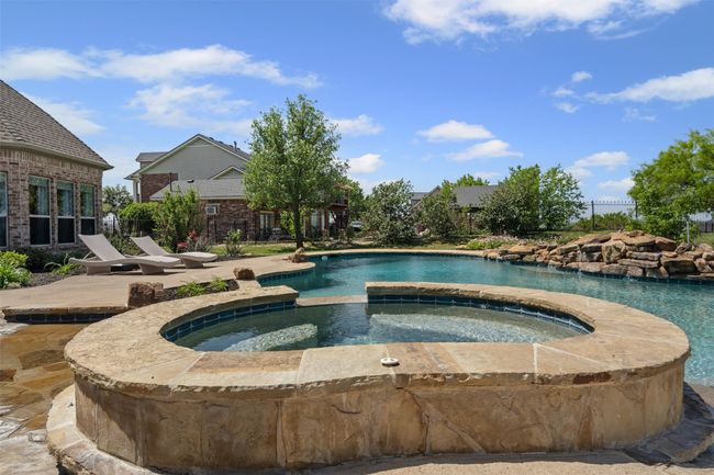 View of pool featuring a patio, an in ground hot tub, and fence | Image 37