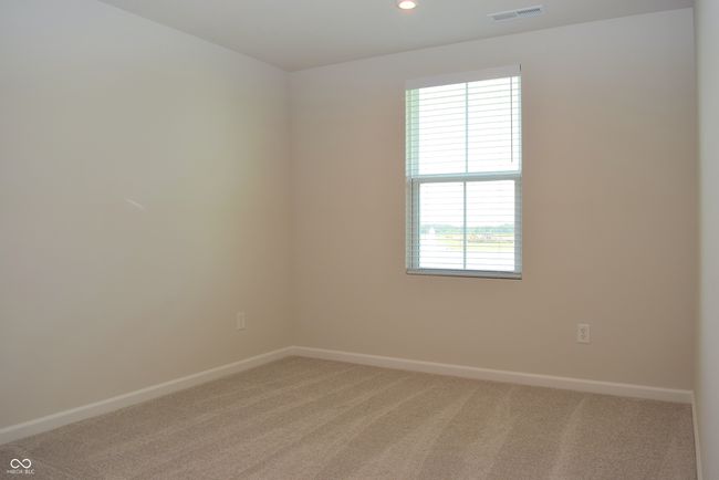 loft at top of stairs with view of pond has closet with furnace | Image 36