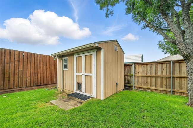 View of shed featuring a fenced backyard | Image 33