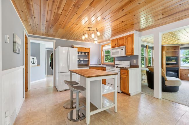 Open floor plan with kitchen views to the lake! | Image 5