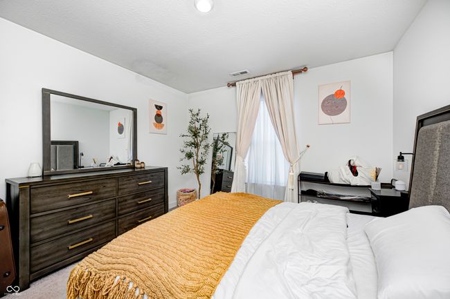 bedroom featuring visible vents and light carpet | Image 18