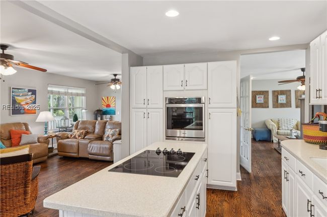 Updated chef's kitchen with stainless steel appliances & ample storage, efficient flow and a window over the sink for a view while prepping and cooking. | Image 17