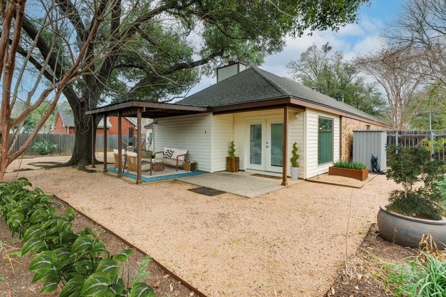 Covered back patio. Image virtually enhanced. | Image 24