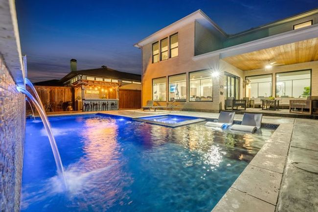 View of pool featuring pool water feature, ceiling fan, a patio area, and an in ground hot tub | Image 34