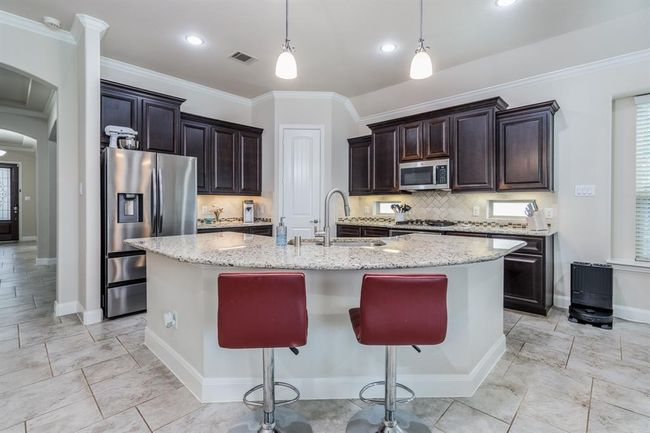 Granite countertops. Walk in pantry. | Image 17