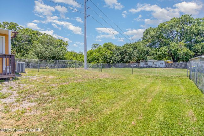 Fenced backyard. Total lot size for property is 0.24 acres. | Image 19