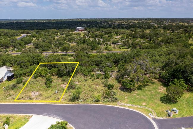 Aerial view of property and surrounding area with property parcel outlined and a heavily wooded area | Image 6