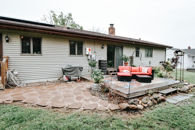 Flagstone patio block by the back patio was added and it was tied into the concrete around the side of the house to the driveway to make the hardscape appear seamless and intentional. | Image 32
