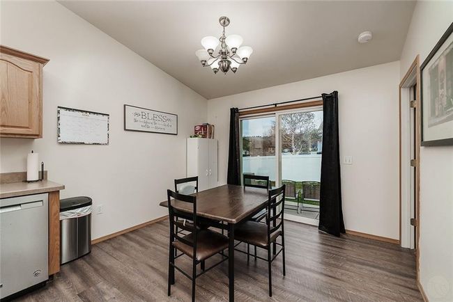 dining with patio door to fenced yard | Image 12