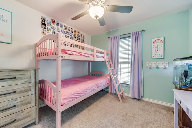 Bedroom featuring baseboards, carpet flooring, and ceiling fan | Image 18