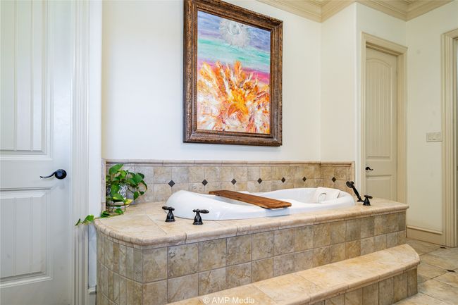 Bathroom with crown molding and tiled tub | Image 23
